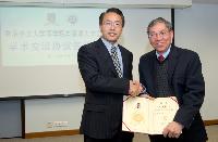 Prof. Chan Wai-Yee (right) receives the Appointment Certificate as Adjunct Professor from Prof. Jiang Wenqi, Director of School of Medicine, SZU